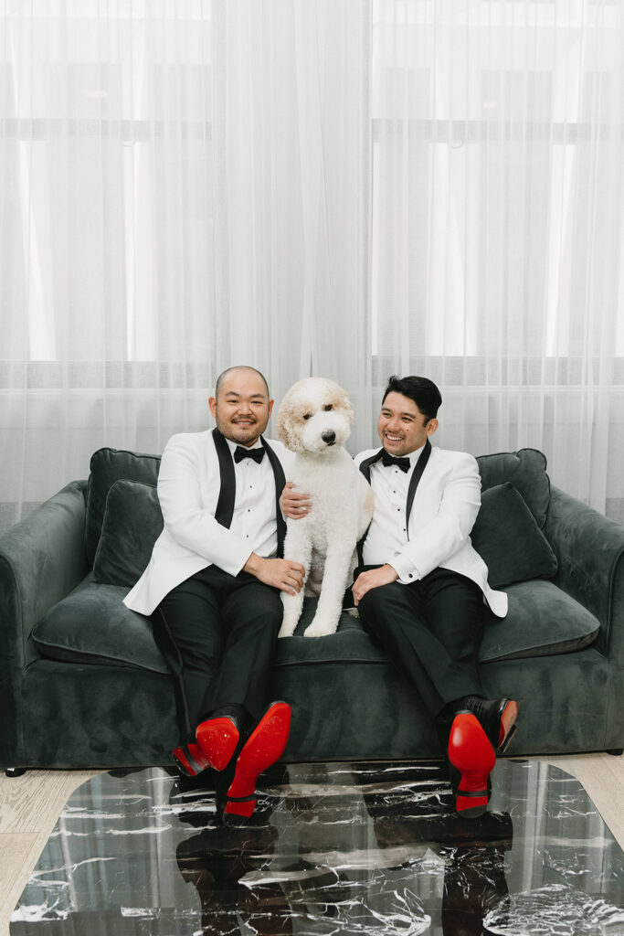 Couple getting ready together with their dog at a Portland hotel on their wedding morning
