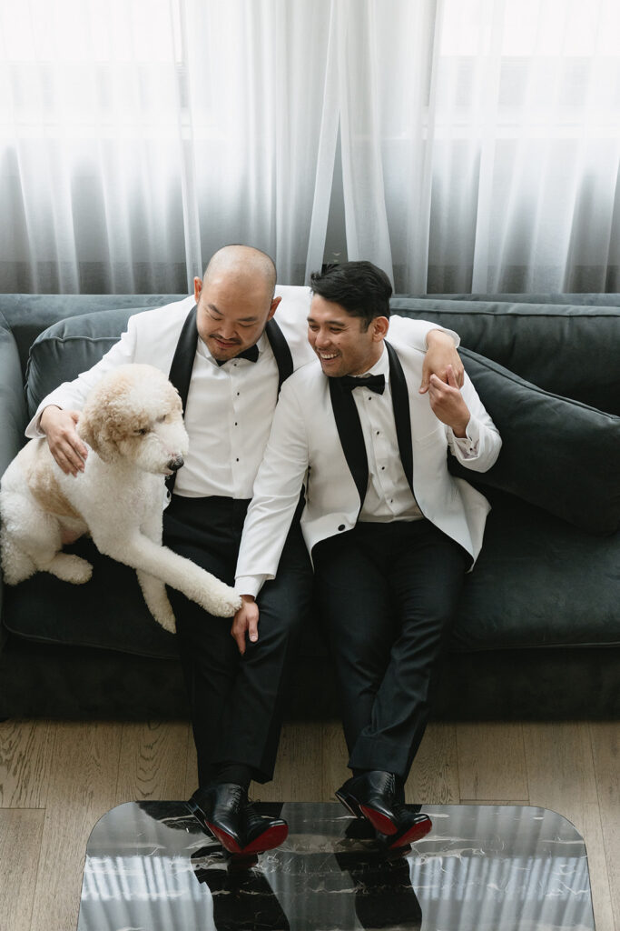 Couple getting ready together with their dog at a Portland hotel on their wedding morning
