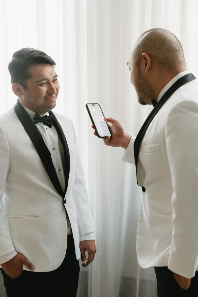 Couple getting ready together with their dog at a Portland hotel on their wedding morning
