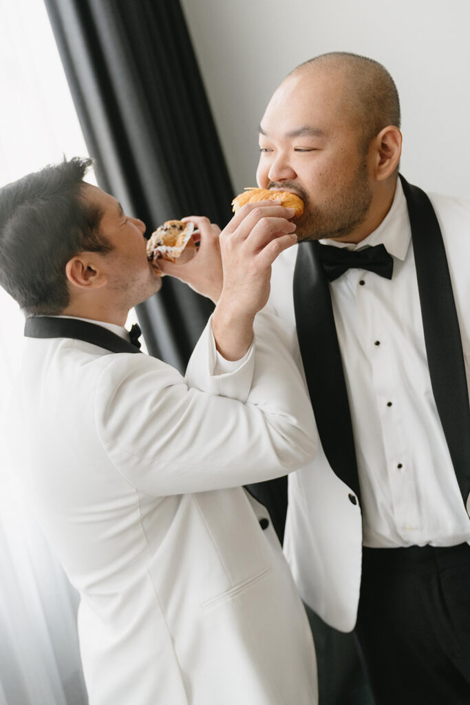 Couple getting ready together with their dog at a Portland hotel on their wedding morning
