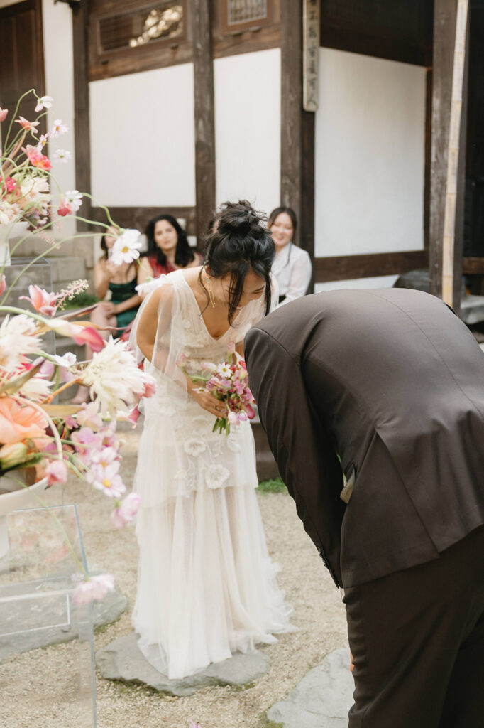 Candid guest reactions during a wedding in Seoul as friends celebrate together in an intimate destination setting.
