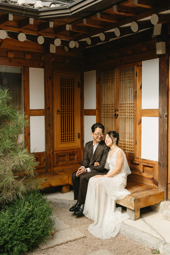 Intimate wedding in Seoul at Rakkojae Hanok with a small group of guests gathered in a traditional Korean courtyard.
