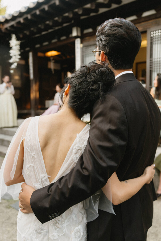 Candid guest reactions during a wedding in Seoul as friends celebrate together in an intimate destination setting.
