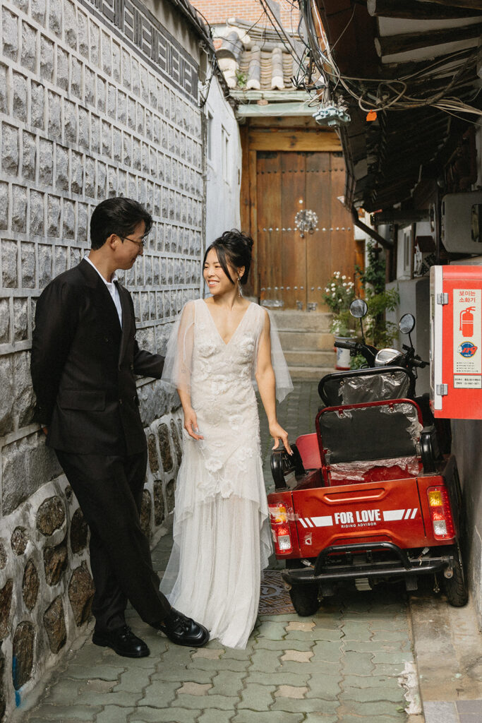Intimate wedding in Seoul at Rakkojae Hanok with a small group of guests gathered in a traditional Korean courtyard.
