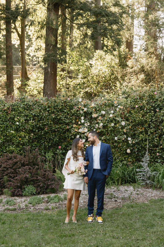 Modern civil union wedding photos at Washington Park featuring newly married couple laughing together outdoors
