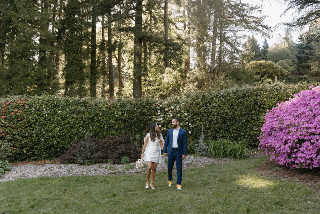 Modern civil union wedding photos at Washington Park featuring newly married couple laughing together outdoors
