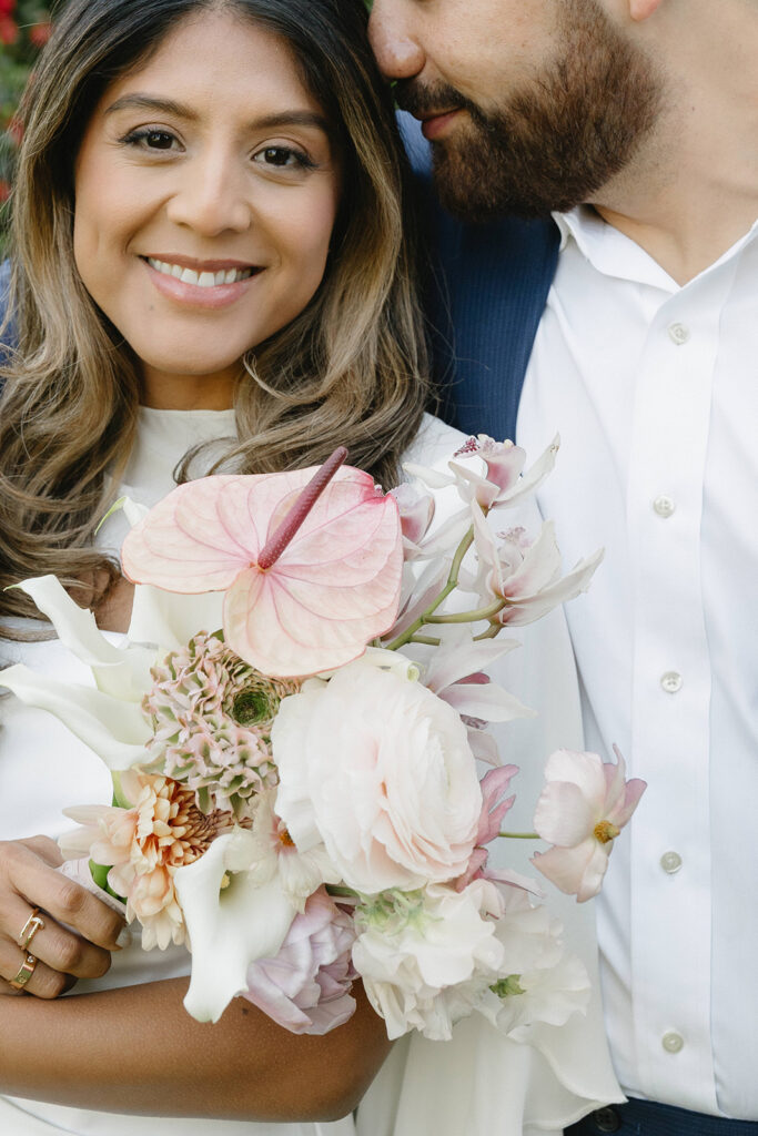 Civil union wedding portraits at the International Rose Garden in Portland, Oregon with couple walking together at sunset
