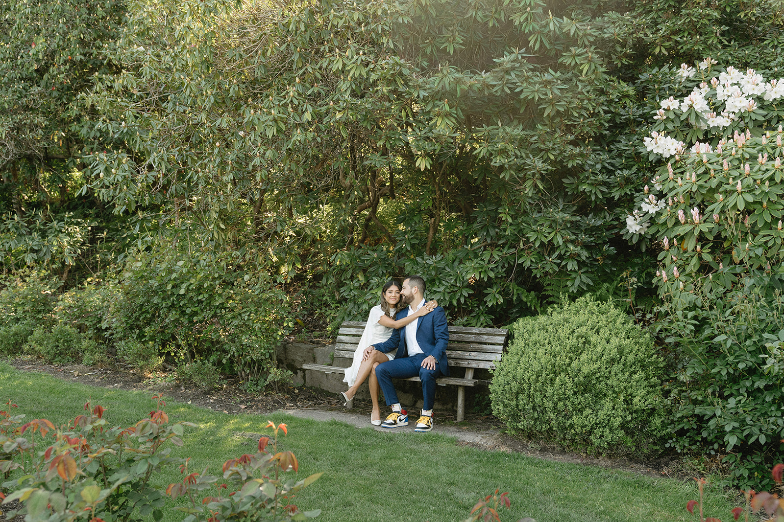 Civil union wedding portraits at the International Rose Garden in Portland, Oregon with couple walking together at sunset